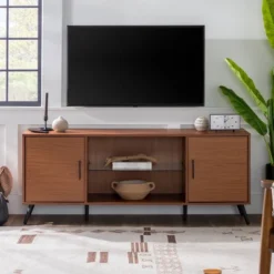 2 Door Mid-Century Modern Wood Storage TV Stand For TVs Up To 65" - Saracina Home 23 2 Door Mid-Century Modern Wood Storage TV Stand For TVs Up To 65" - Saracina Home -Quality Furniture Store GUEST e87ef0ee c10e 4106 930a 1a5aabd9a0c0